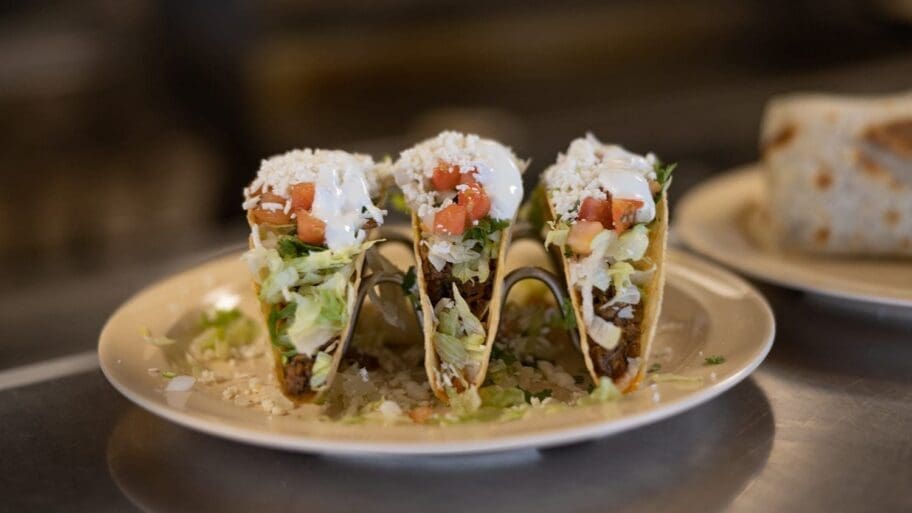 Crisp-shell beef tacos with fresh queso at Floriano's