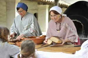 Docents making bread at La Purisima