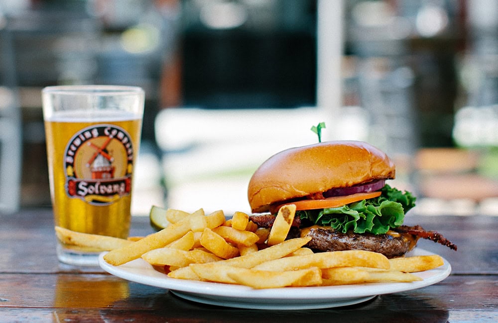 Burger with fries and a glass of beer in Lompoc California.