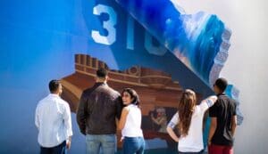 Group of friends looking at Boatmen Mural in Lompoc