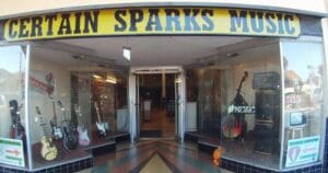 The entrance to Certain Sparks Music store, with instruments displayed in the window