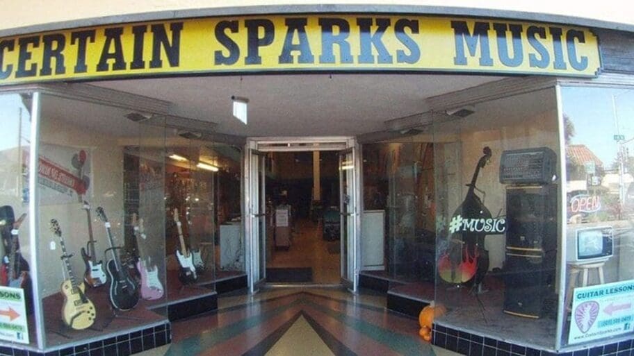 The entrance to Certain Sparks Music store, with instruments displayed in the window