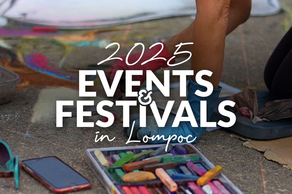 Chalk pastels and a smartphone lie on the ground, highlighting 2025 Events & Festivals in Lompoc, capturing the vibrant spirit of this charming town.