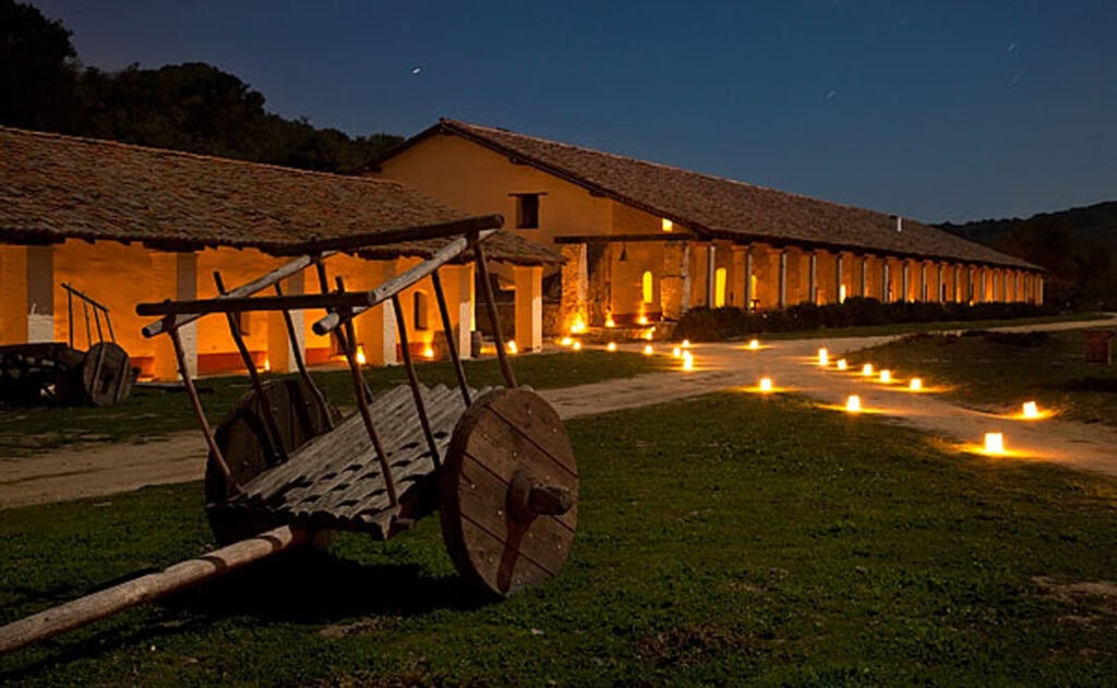 Photo of La Purisima Mission at night with candles