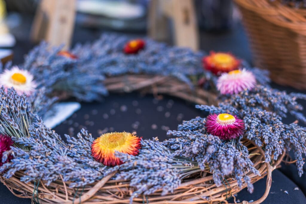 Lavender and colorful flowers arranged in a wreath for a local event in Lompoc.