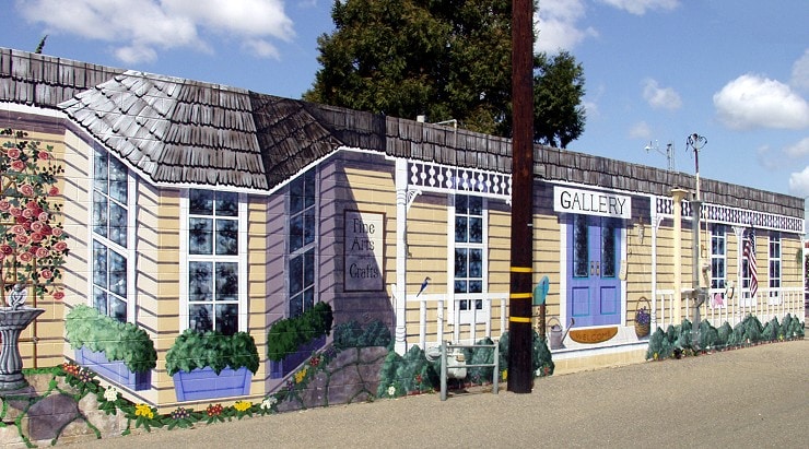 Colorful art gallery building in Lompoc with flowers and greenery.