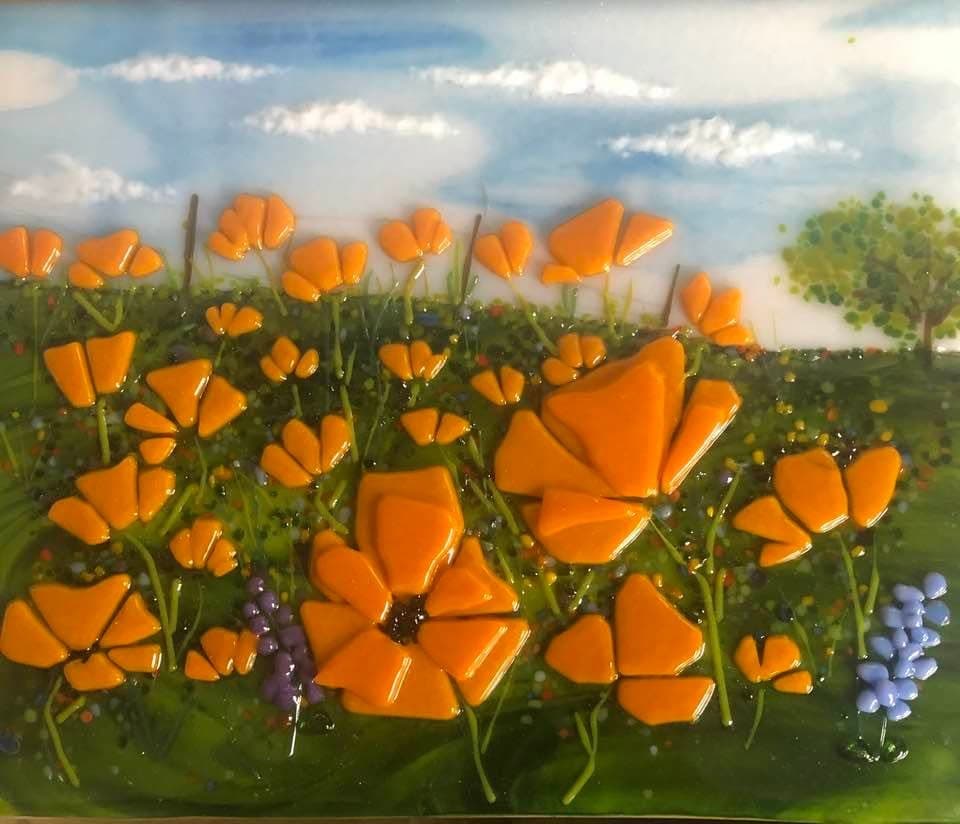 Colorful glass flower art representing Lompoc's creative community.