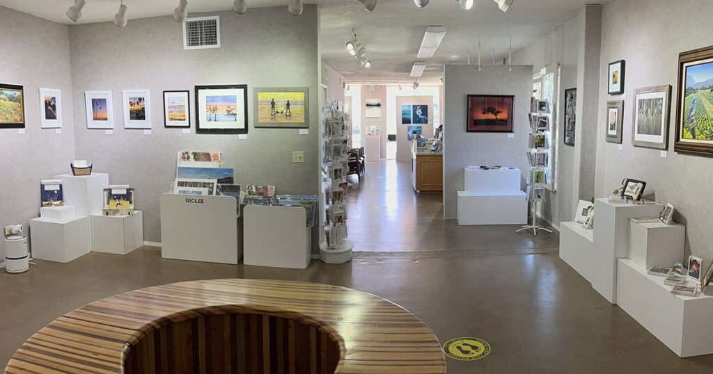 Art gallery in Lompoc California with paintings and sculptures on display.